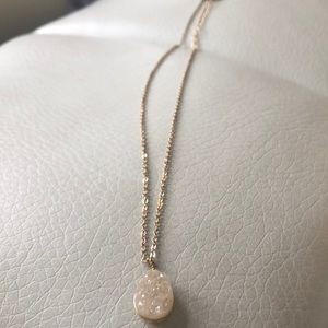 Gold necklace with crystal pendant